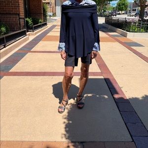 Dark navy, one piece with swing hem.